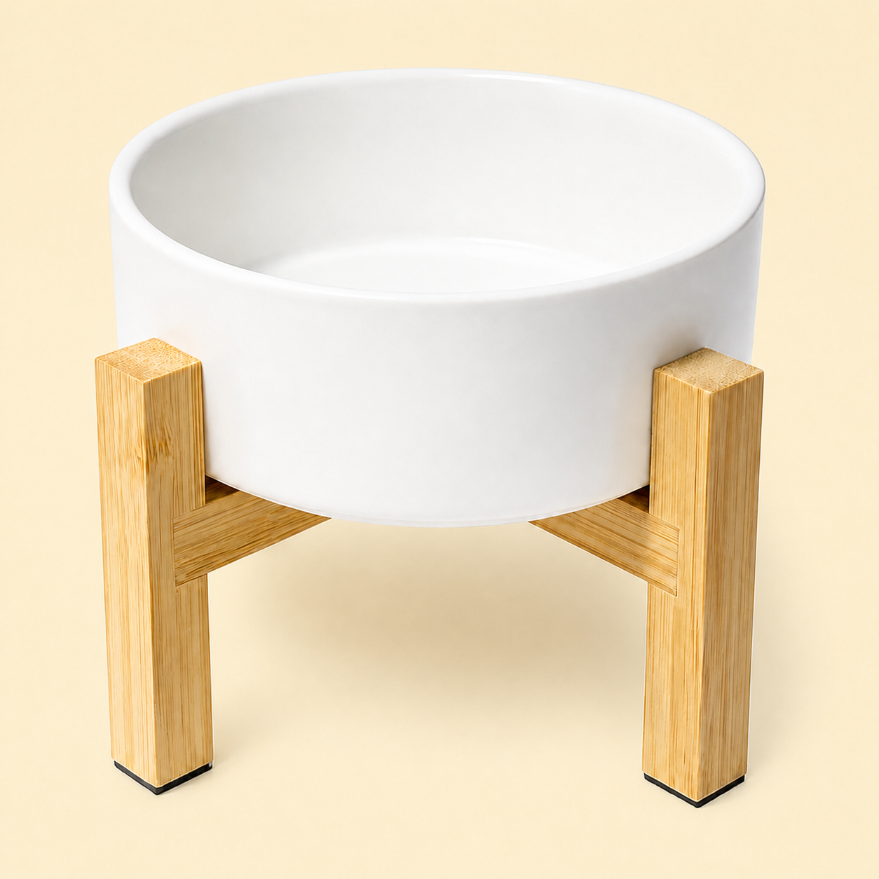 White elevated ceramic pet bowl with reversible bamboo stand on a warm cream background